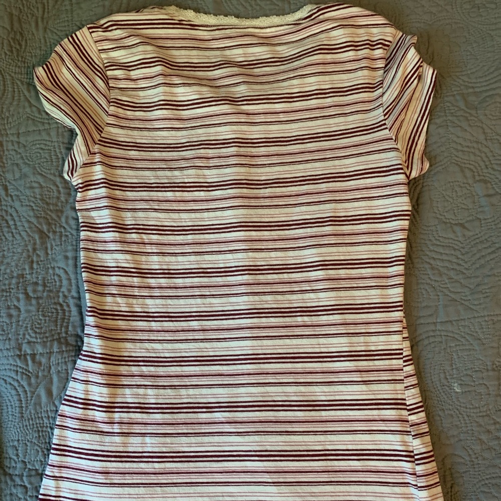 Red white pink striped shirt.